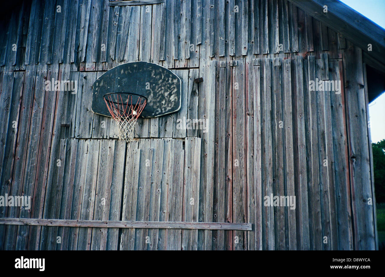 A basketball hoop on a barn Stock Photo Alamy