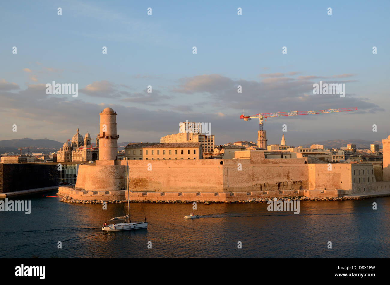 Sunset over the Fort Saint Jean at the Entrance to the Vieux Port or Old Port Marseille at Dusk Marseille Provence France Stock Photo