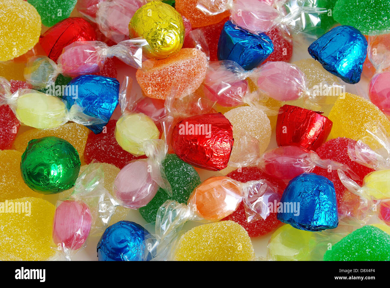 Background of assorted colorful candies, chocolates and jellies Stock