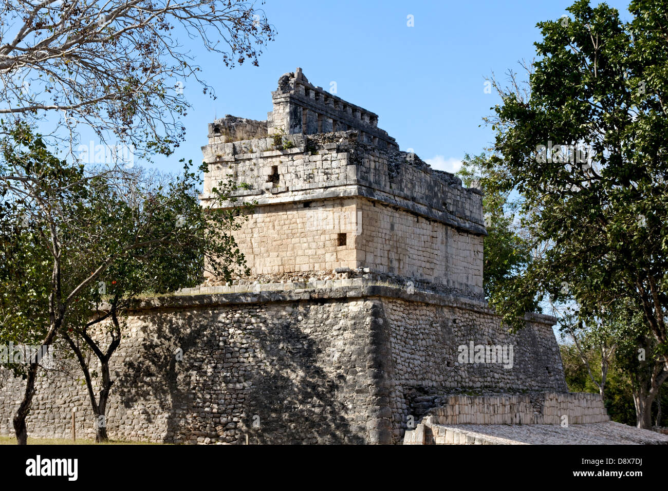 Mayan ruin amongst tropical bushes at Chichen Itza, Yucatan, Mexico. Stock Photo