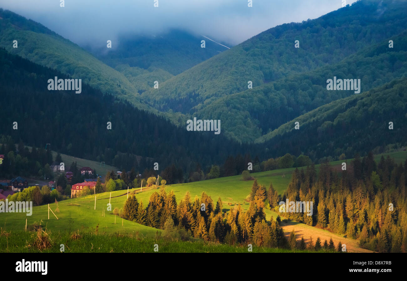 Spring cloudy morning rural landscape in the Carpathian mountains. Stock Photo