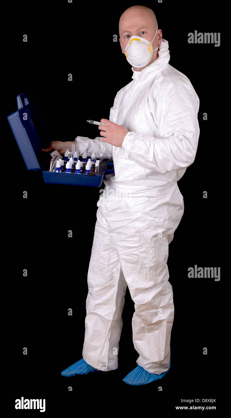 man in protective suit working with lab equipment Stock Photo