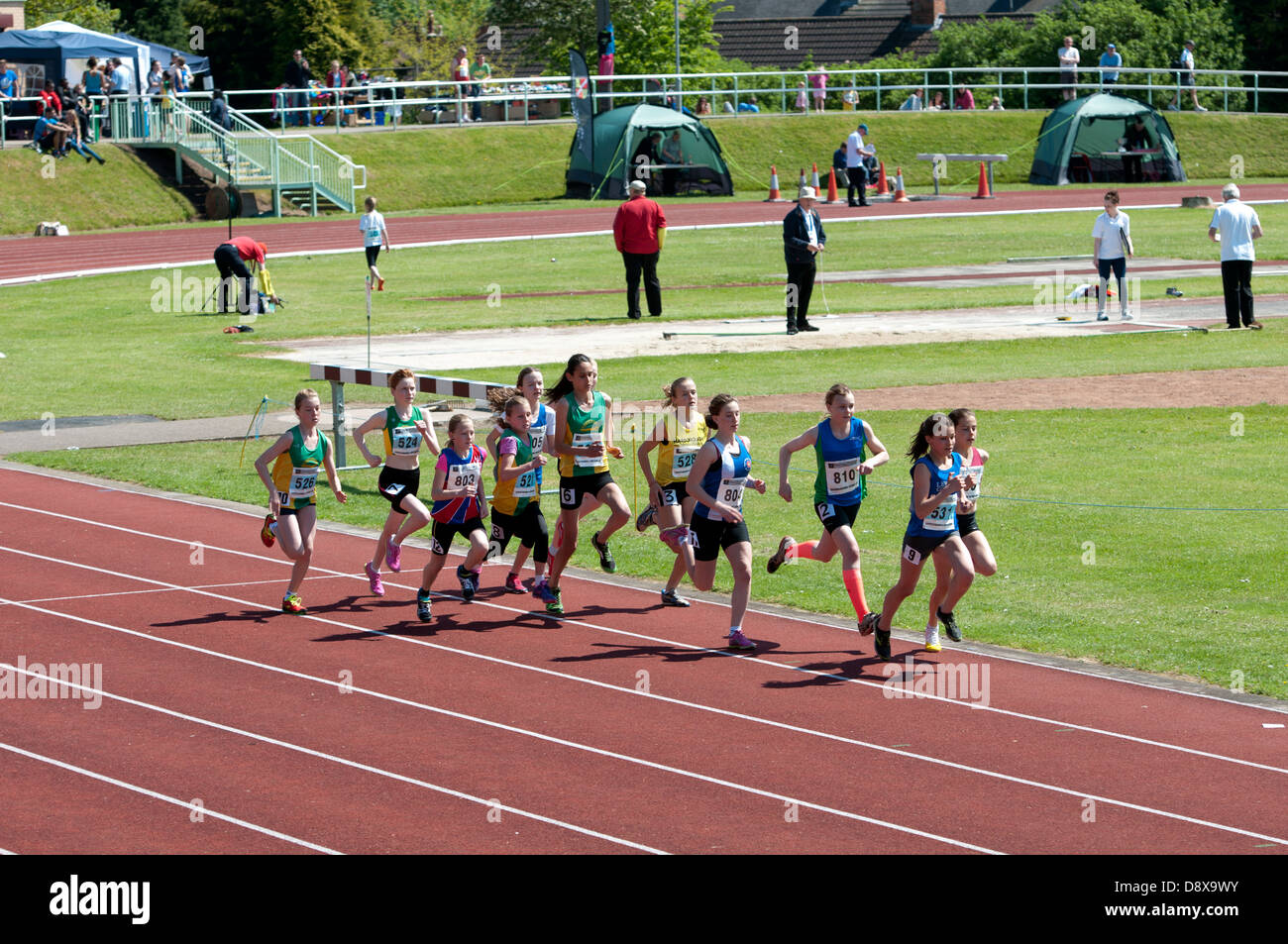 Athletics, teenage girls middle-distance track race. Stock Photo