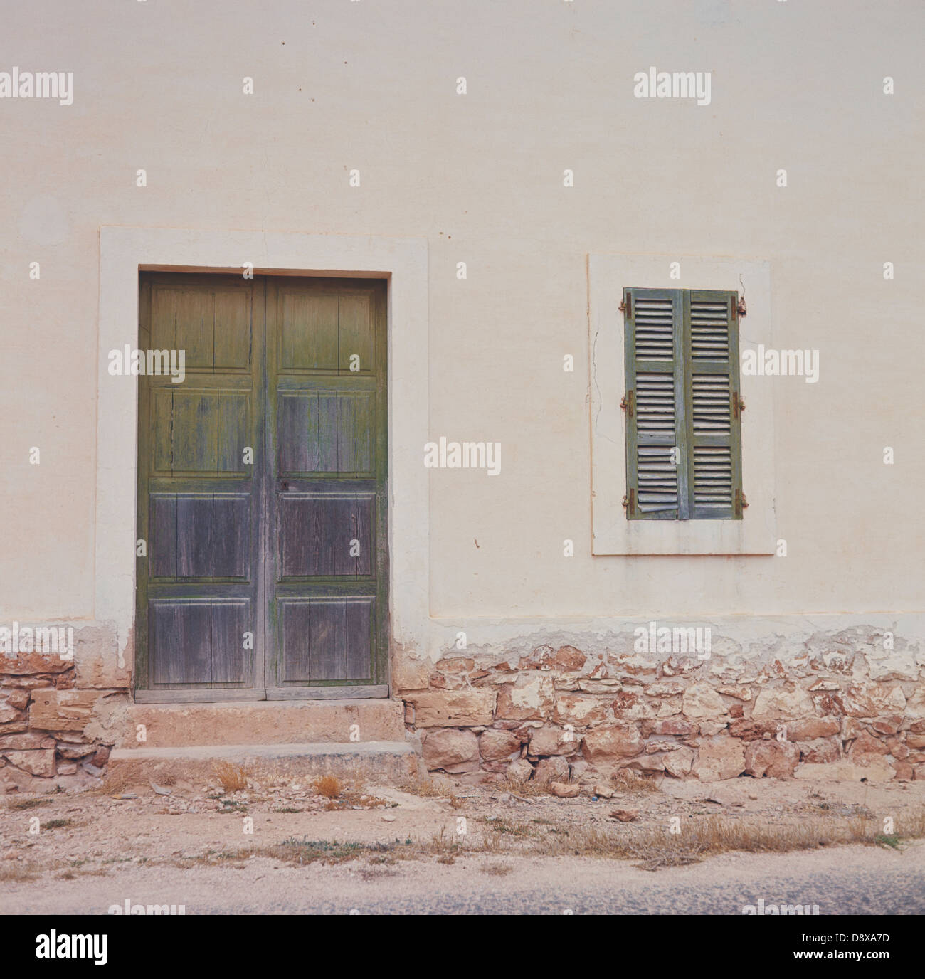 A facade with closed door and window Stock Photo - Alamy