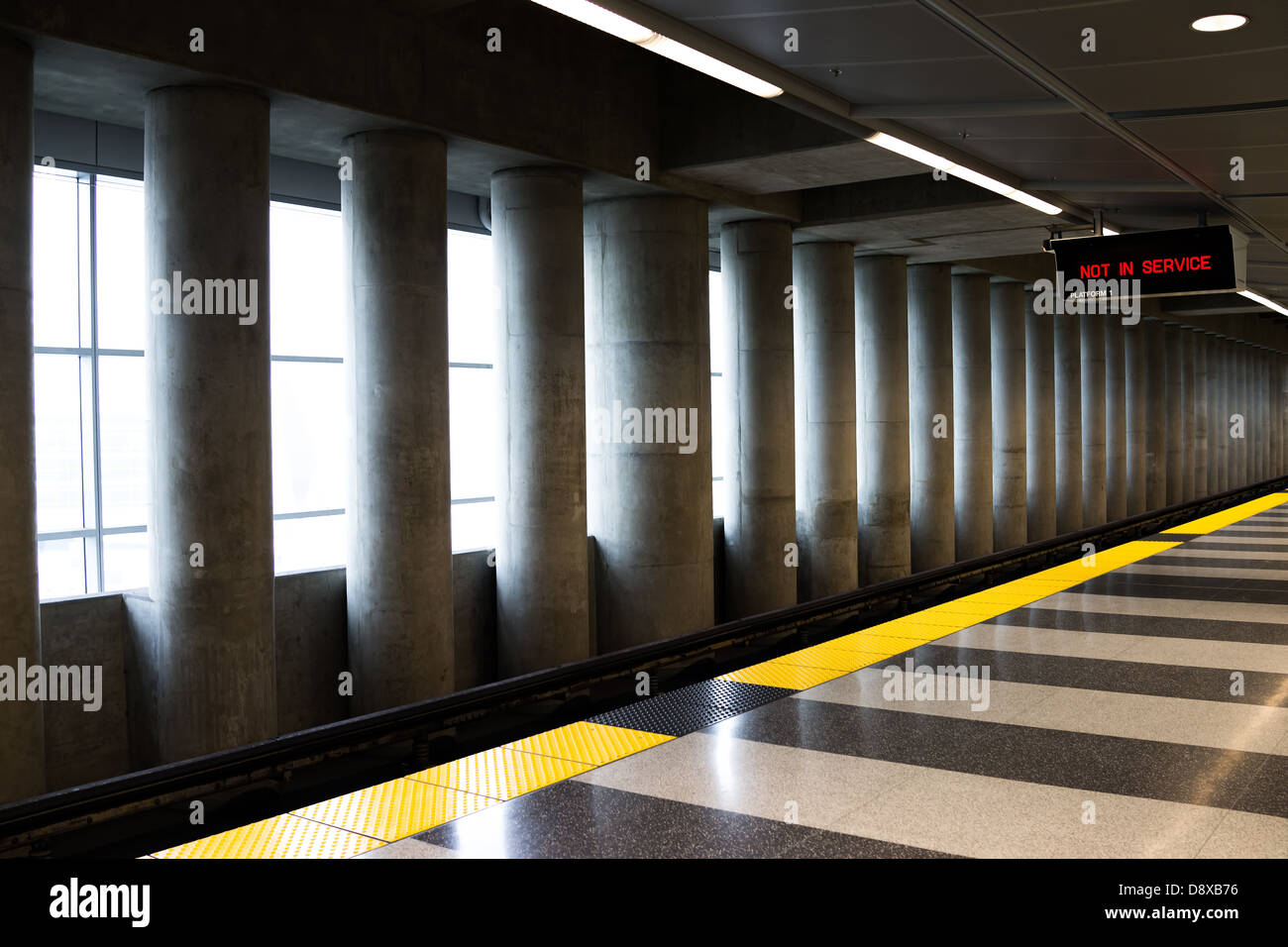 Empty train platform with gray and yellow lines Stock Photo