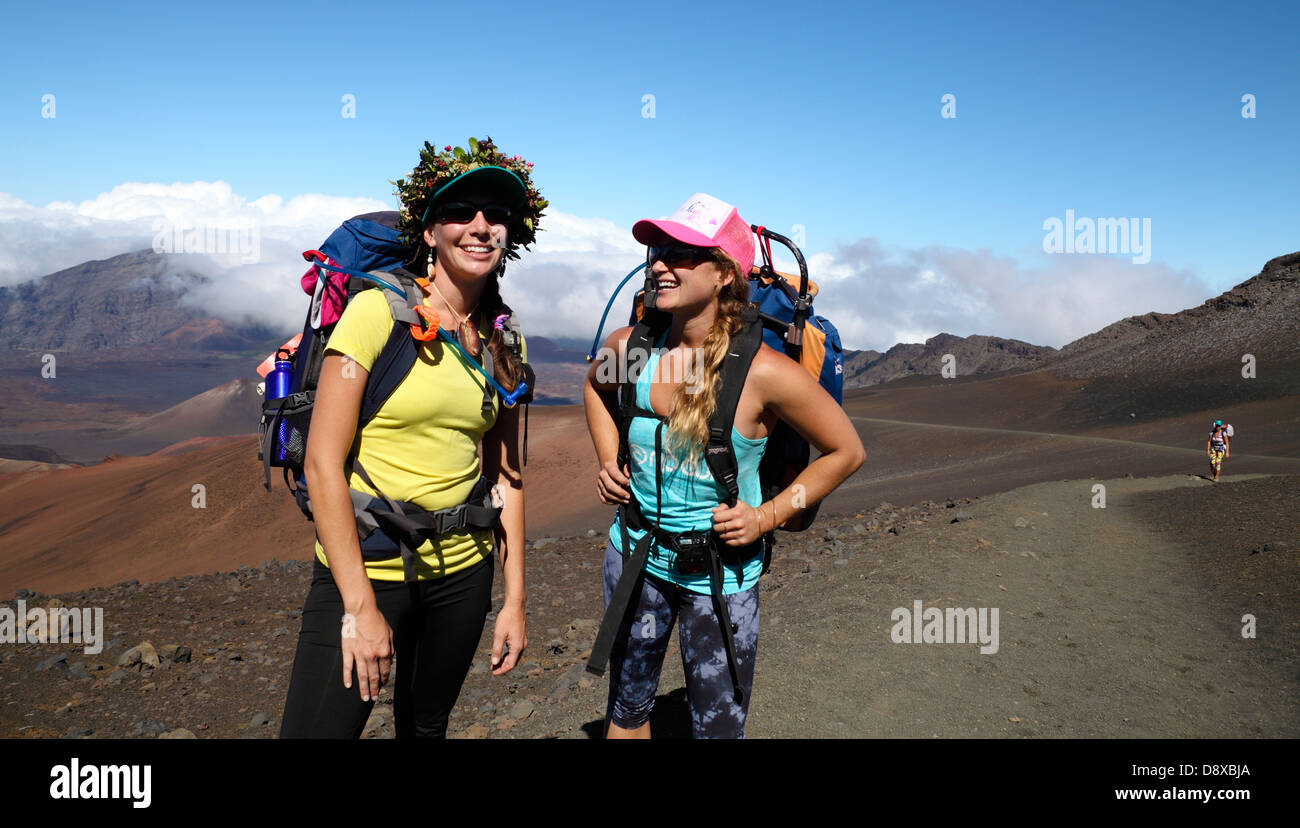 Friends hiking the Sliding Sands Trail at Haleakala National Park on Maui Stock Photo