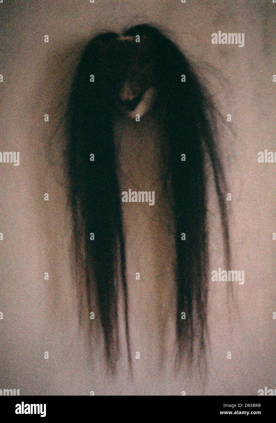 A mask with long hair. Stock Photo