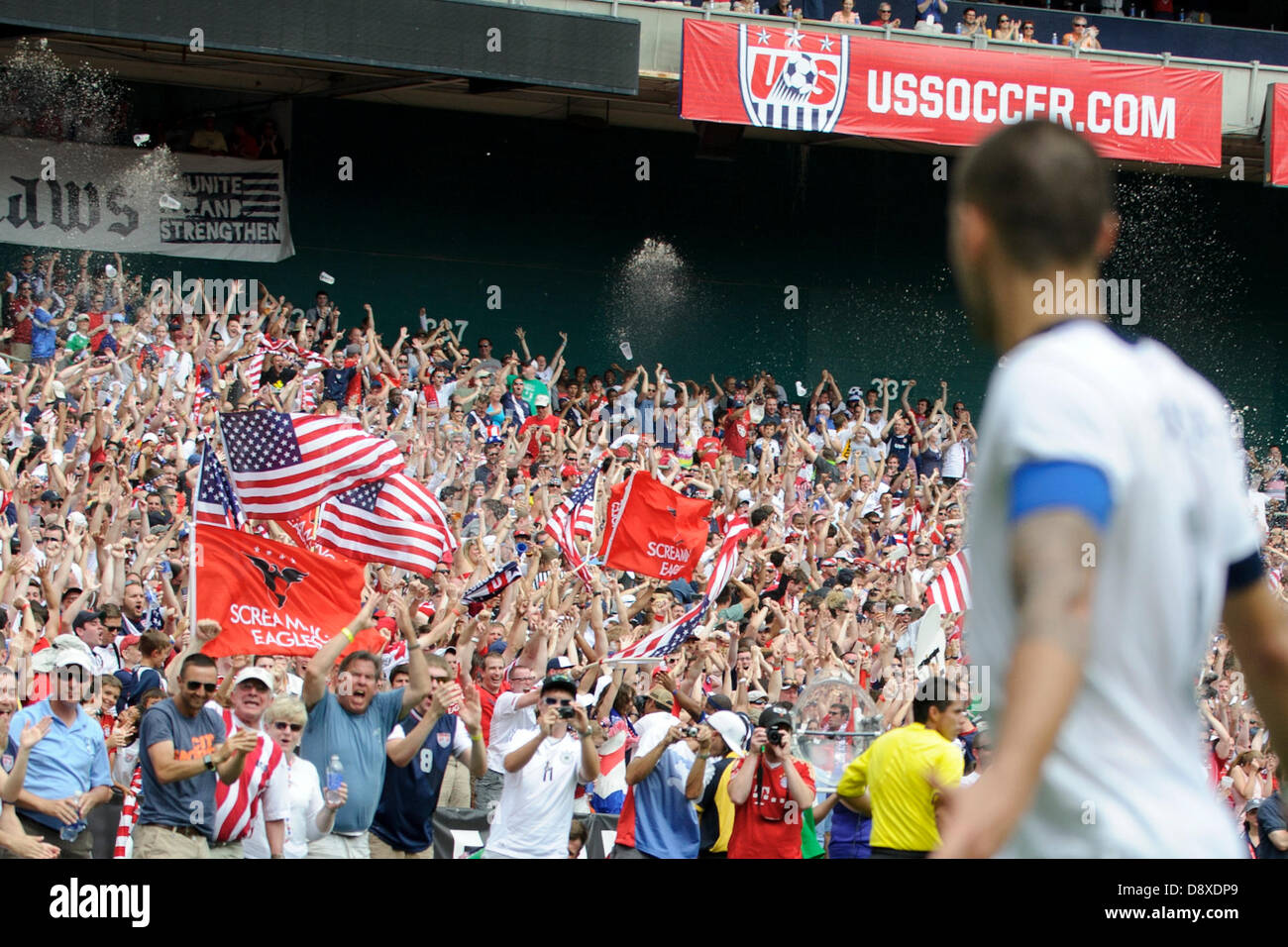 June 2, 2013 - Washington Dc, District of Columbia, U.S - June 02, 2013: U.S. Men's National Team forward Clint Dempsey (8) watches the crowd cheer and wave flags after he scored a goal during the U.S. Men's National Team vs. German National Team- Centennial celebration match at RFK Stadium - Washington, D.C. The U.S. Men's National Team defeats Germany 4-3. Stock Photo