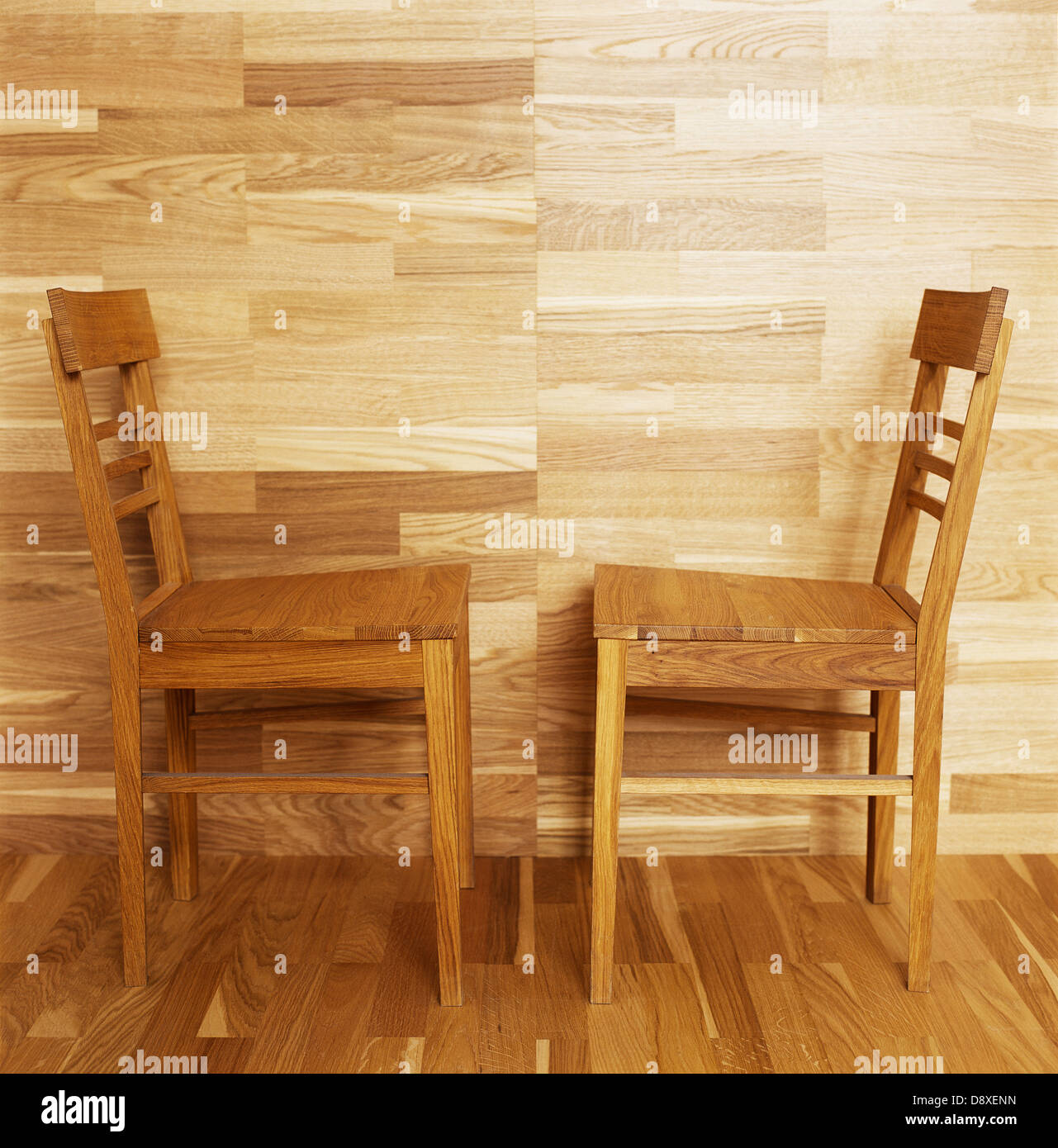 Wooden Chairs by a Wooden Wall and Parquet Floor Stock Photo - Alamy