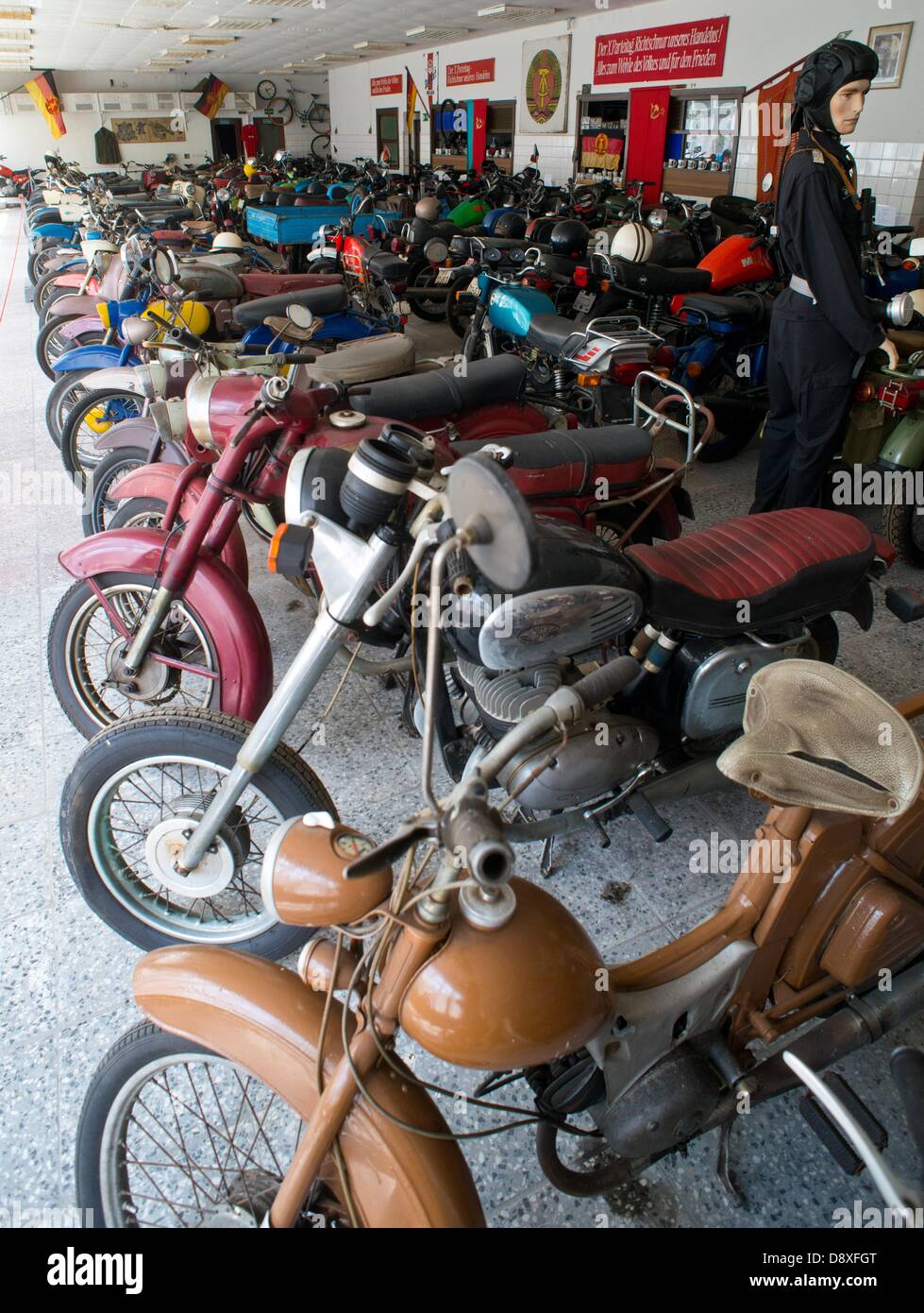 A room full of motorcycles from the Eastern bloc is pictured in the historical vehicle park of the Brunner family in Harnekop, Germany, 19 May 2013. Photo: PATRICK PLEUL Stock Photo