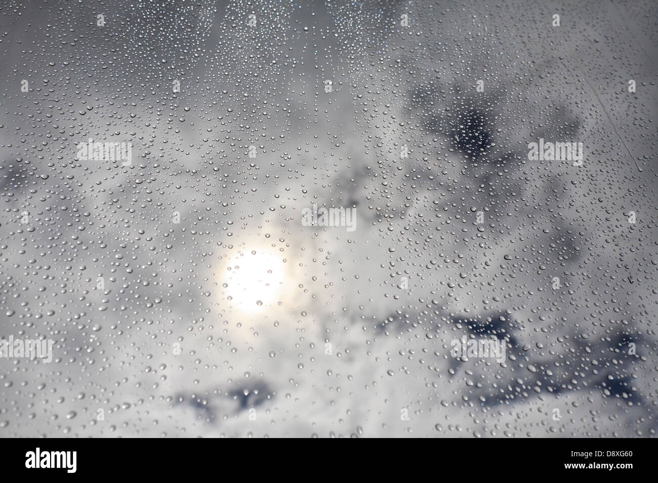 Waterdrops on window against Sky Stock Photo