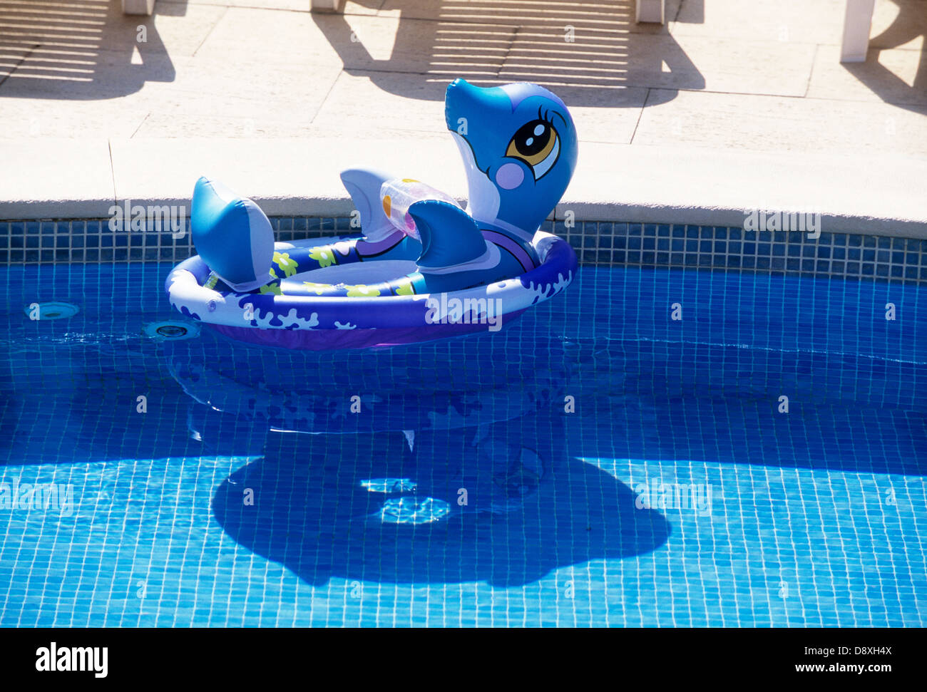 An inflatable swimming ring in a swimmingpool Stock Photo - Alamy