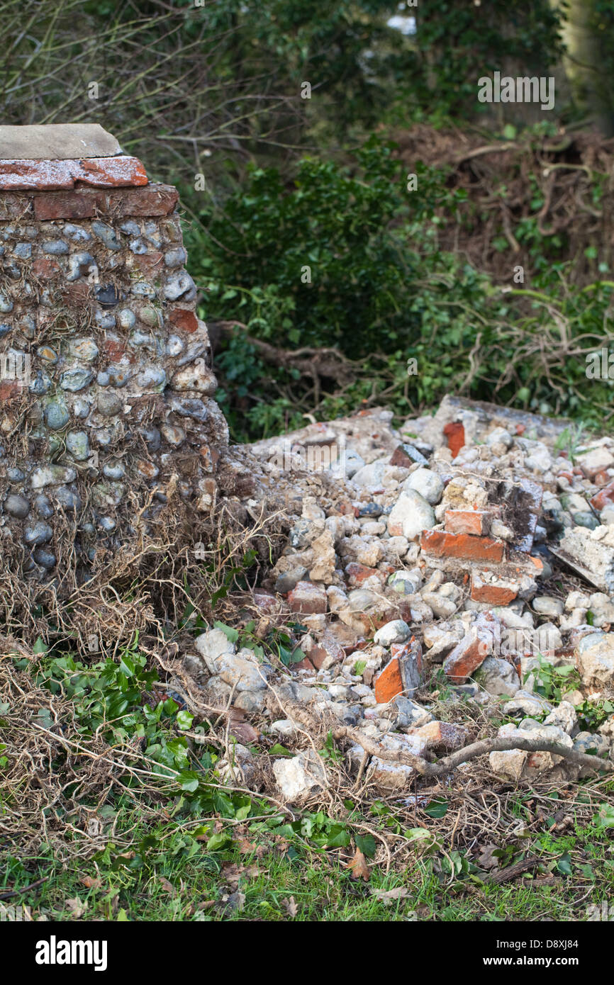 Flint stone wall, partially collapsed. Hickling Hall, Hickling , Norfolk. Awaiting repair and re-build. Broadland, Norfolk. Stock Photo