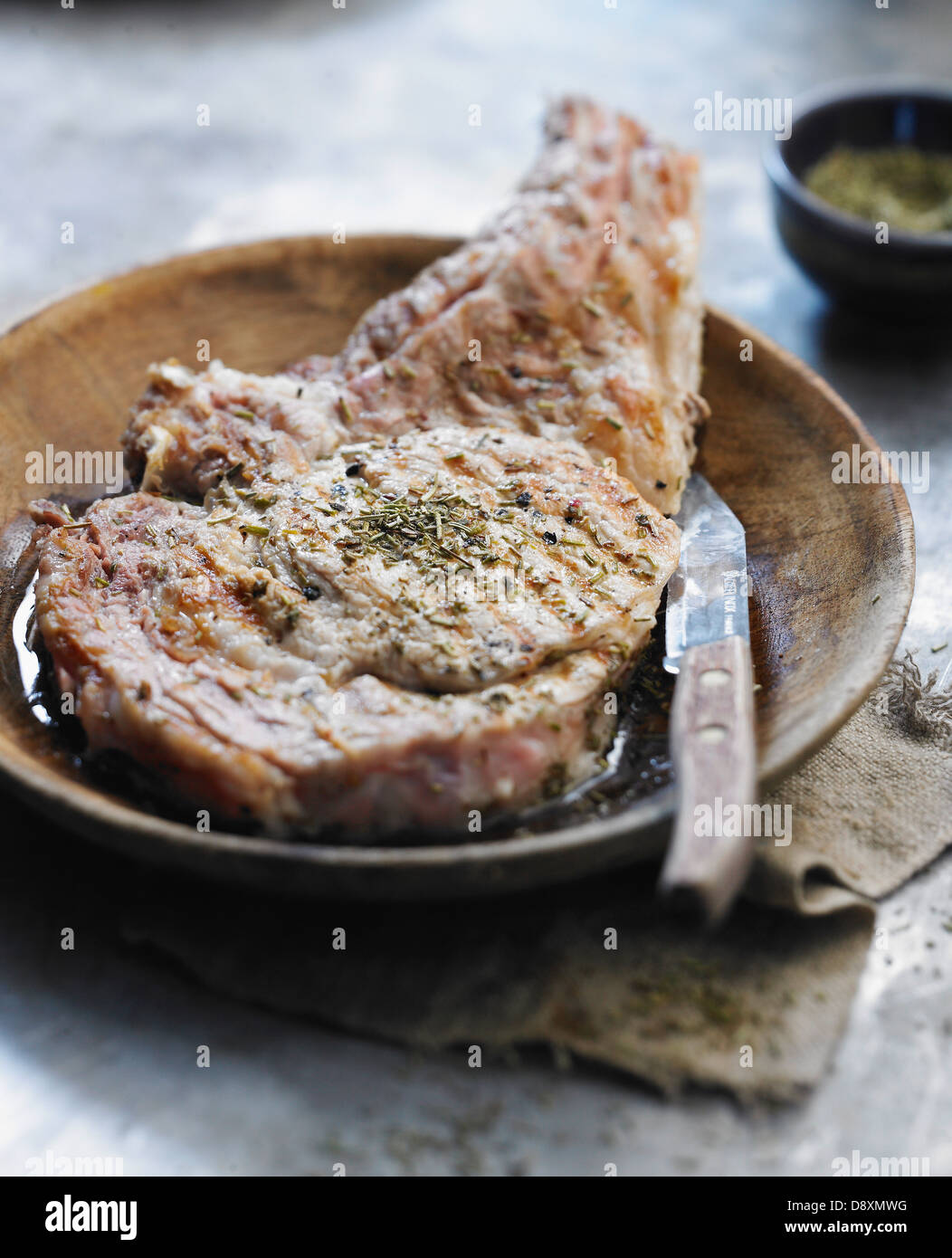Grilled veal chop with herbs Stock Photo