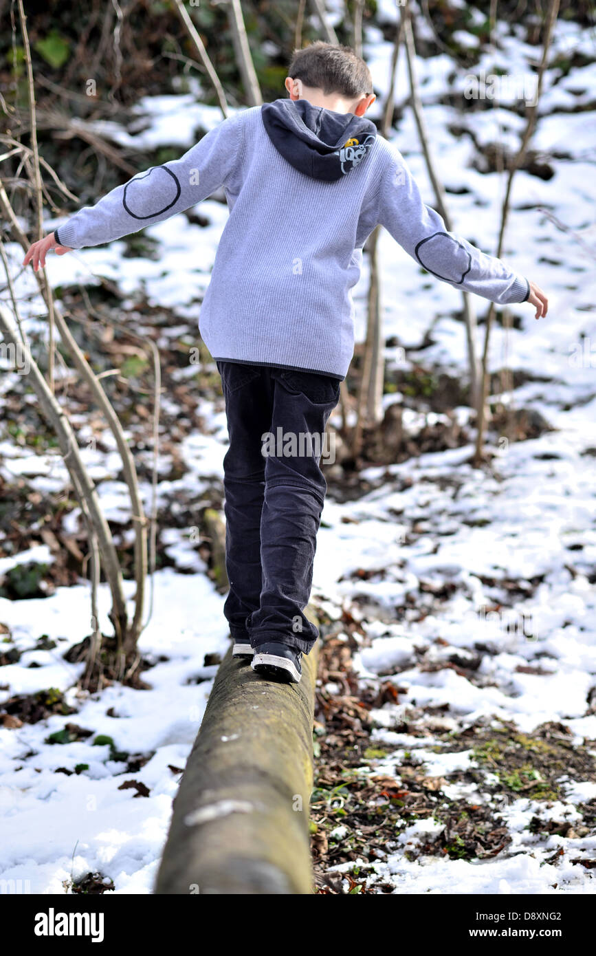 Boy walking in woods hi-res stock photography and images - Alamy