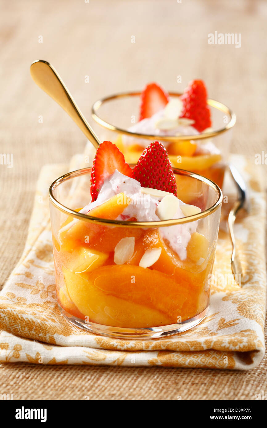 Peach and apricot fruit salad with strawberry mousse Stock Photo Alamy