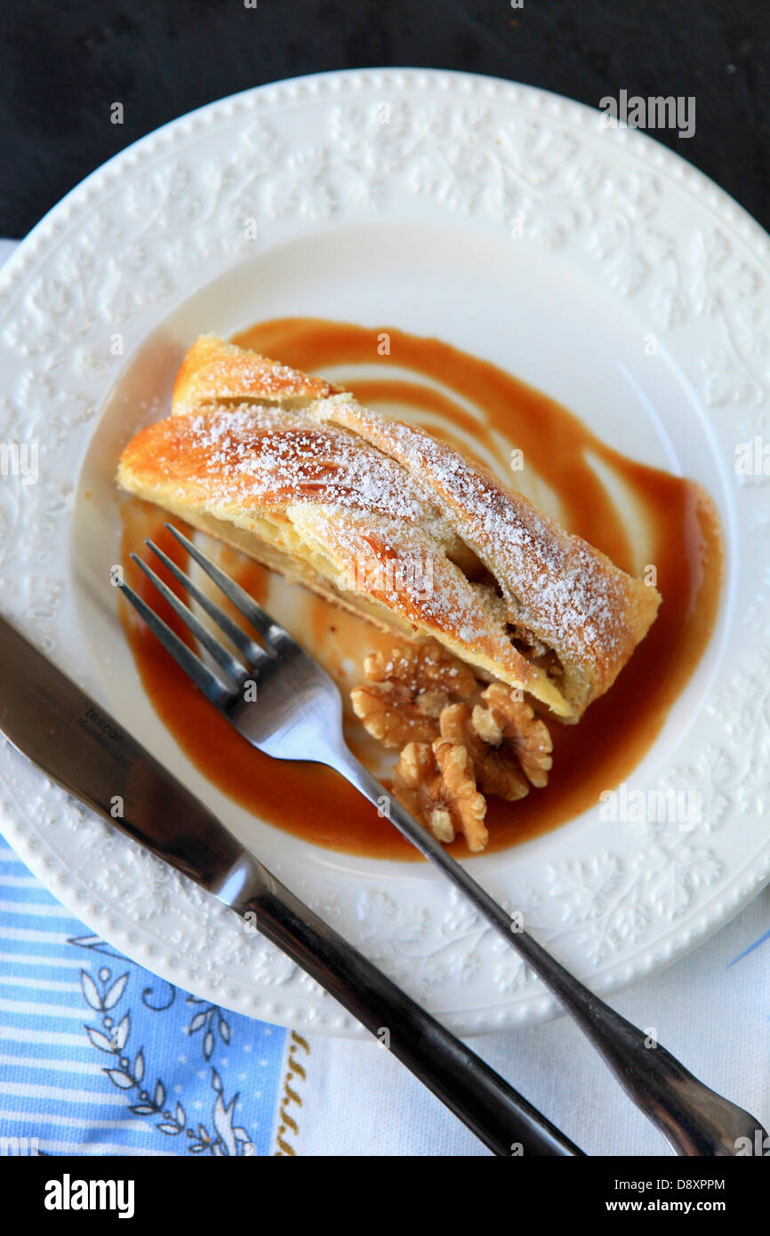 Apple and walnut strudel with toffee sauce Stock Photo