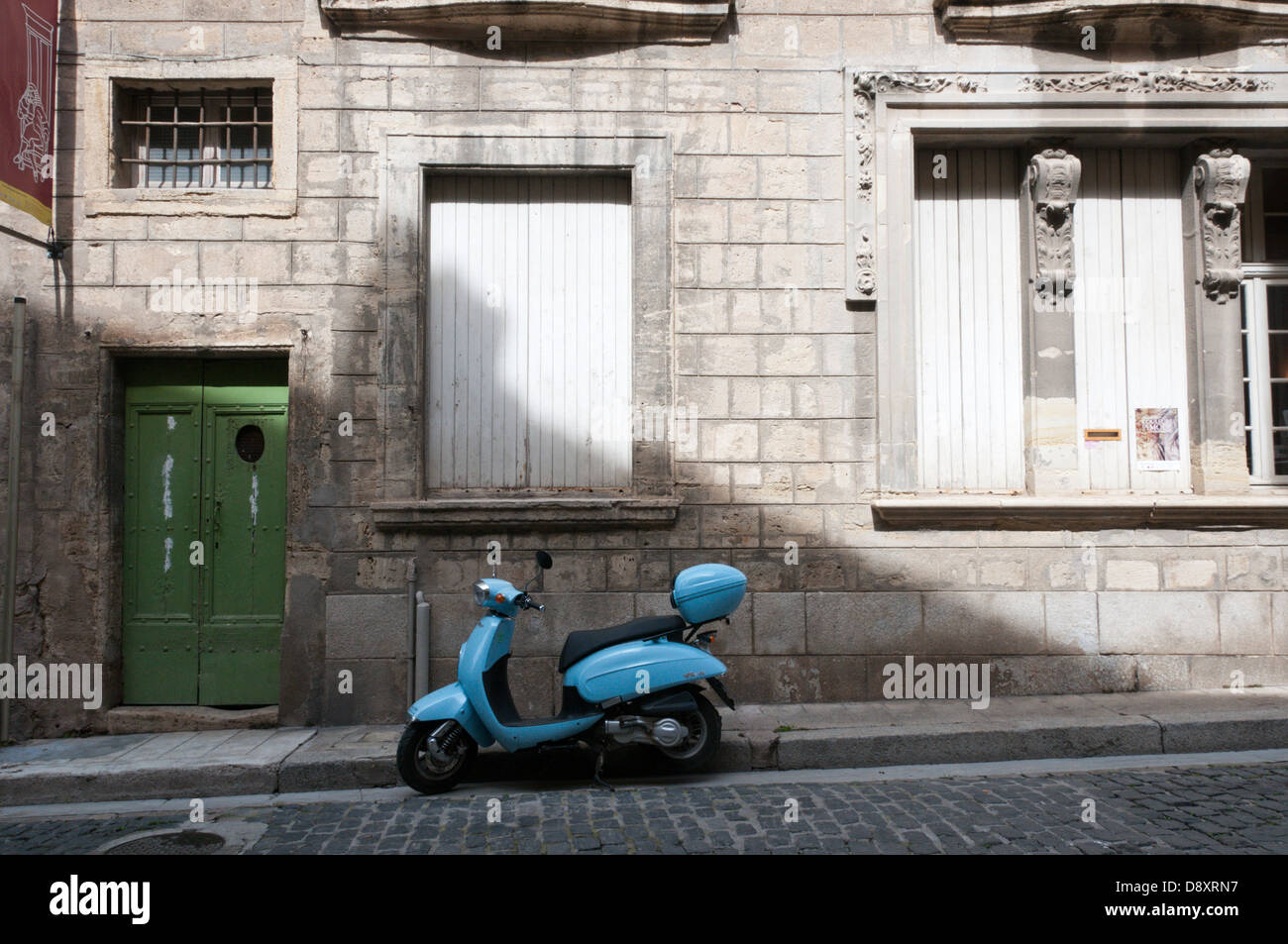 A retro styled Daelim Besbi motor scooter parked beside the kerb in a small southern French town. Stock Photo