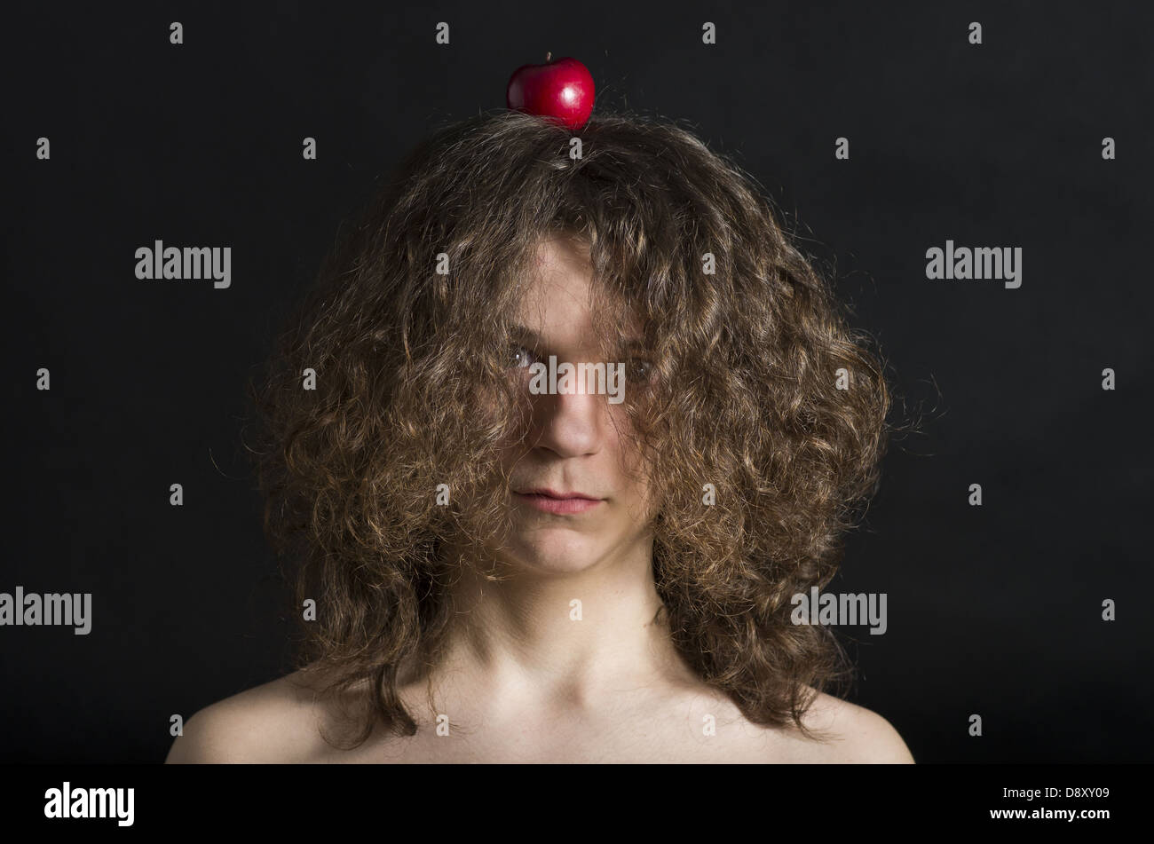 Portrait of the boy with an apple on his head Stock Photo