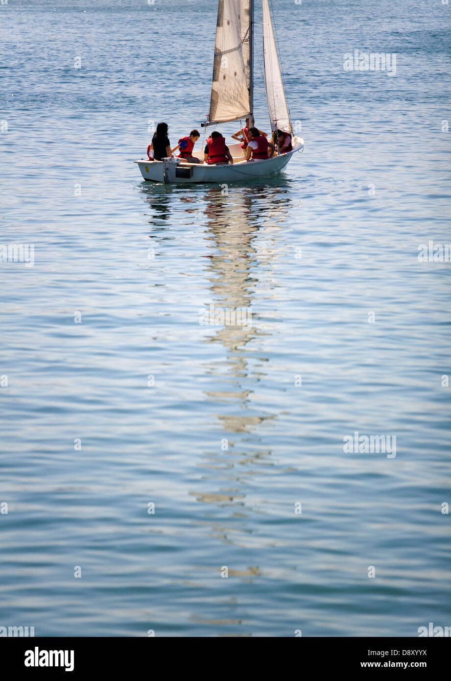 sailing boat instructor and pupils sailing. Santoña. Cantabria. Spain