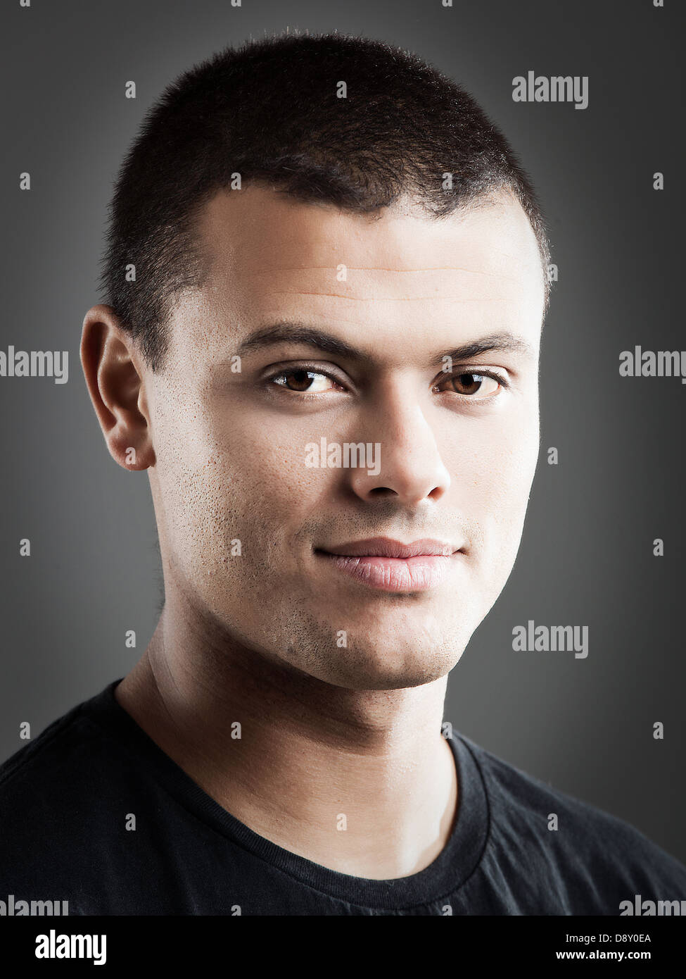 Portrait of a handsome young man, over a gray background Stock Photo ...