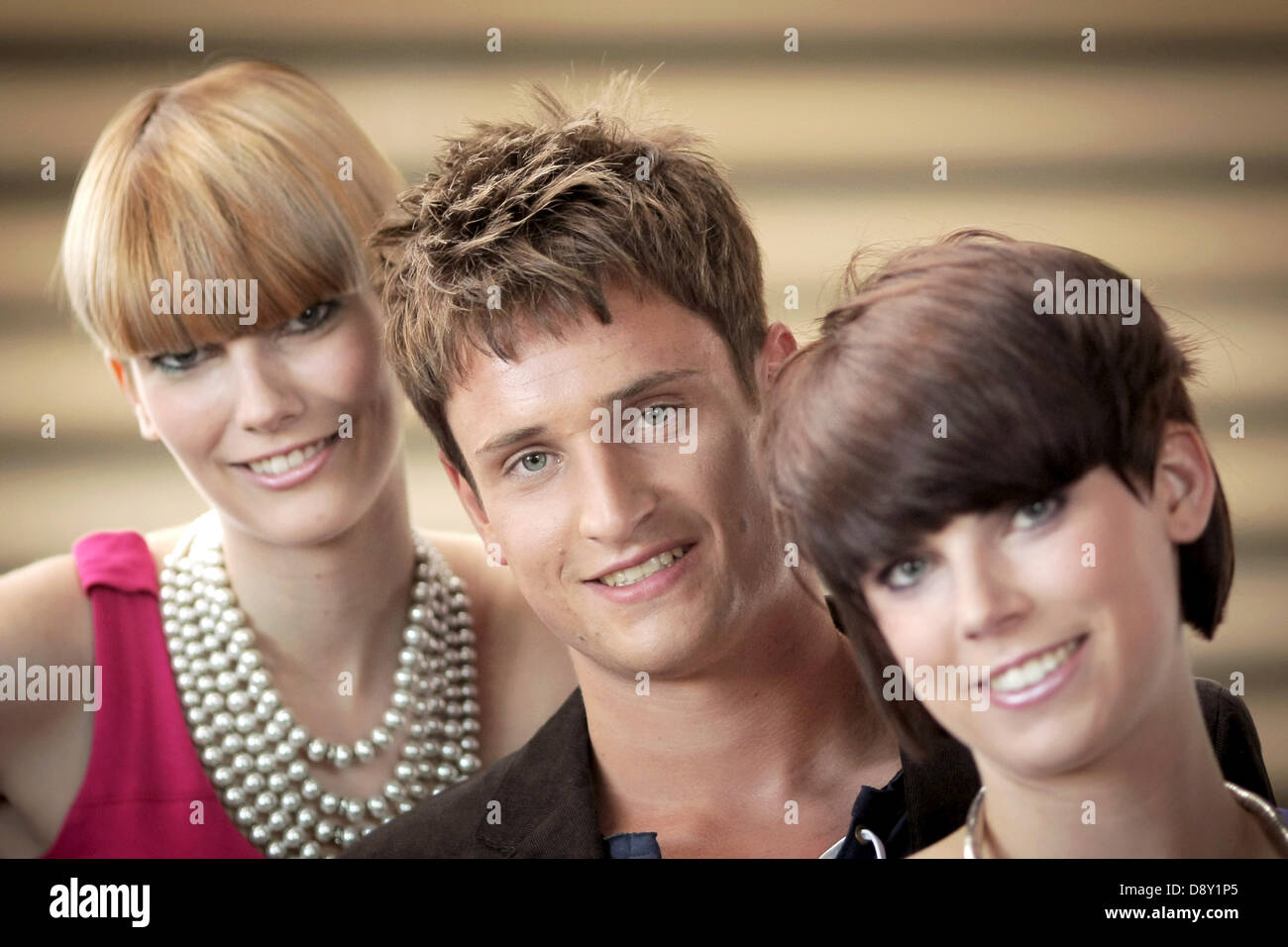 The models Ramona (R), Tim and Vanessa present the new haircut trends 'Aufgesetzter Bob' ('Bob put on top') (L-R), 'Mr Spock' and 'Dr Bob'  at the fair 'Hair and Beauty 2013' in Frankfurt/Main, Germany, 06 June 2013. The fair presenting this summer's haircuts by the central association of the German hairdresser trade amongst other things will take place on 09 and 10 June 2013. Photo: FREDRIK VON ERICHSEN Stock Photo