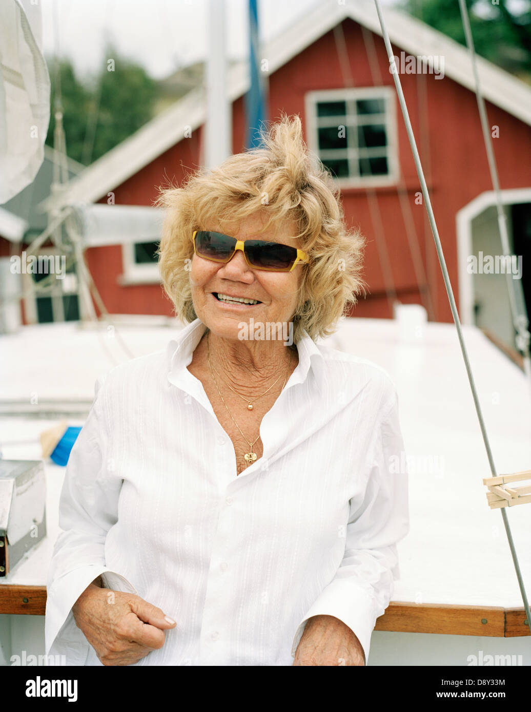 Smiling woman leaning on boat hi-res stock photography and images - Alamy