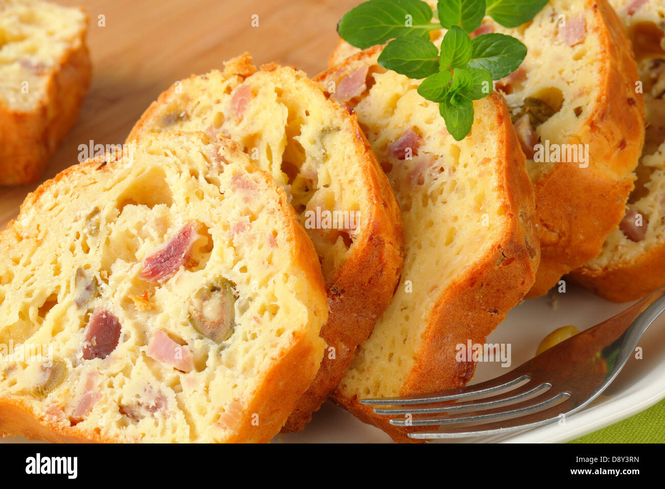Slices of savory ham and olive cake Stock Photo Alamy