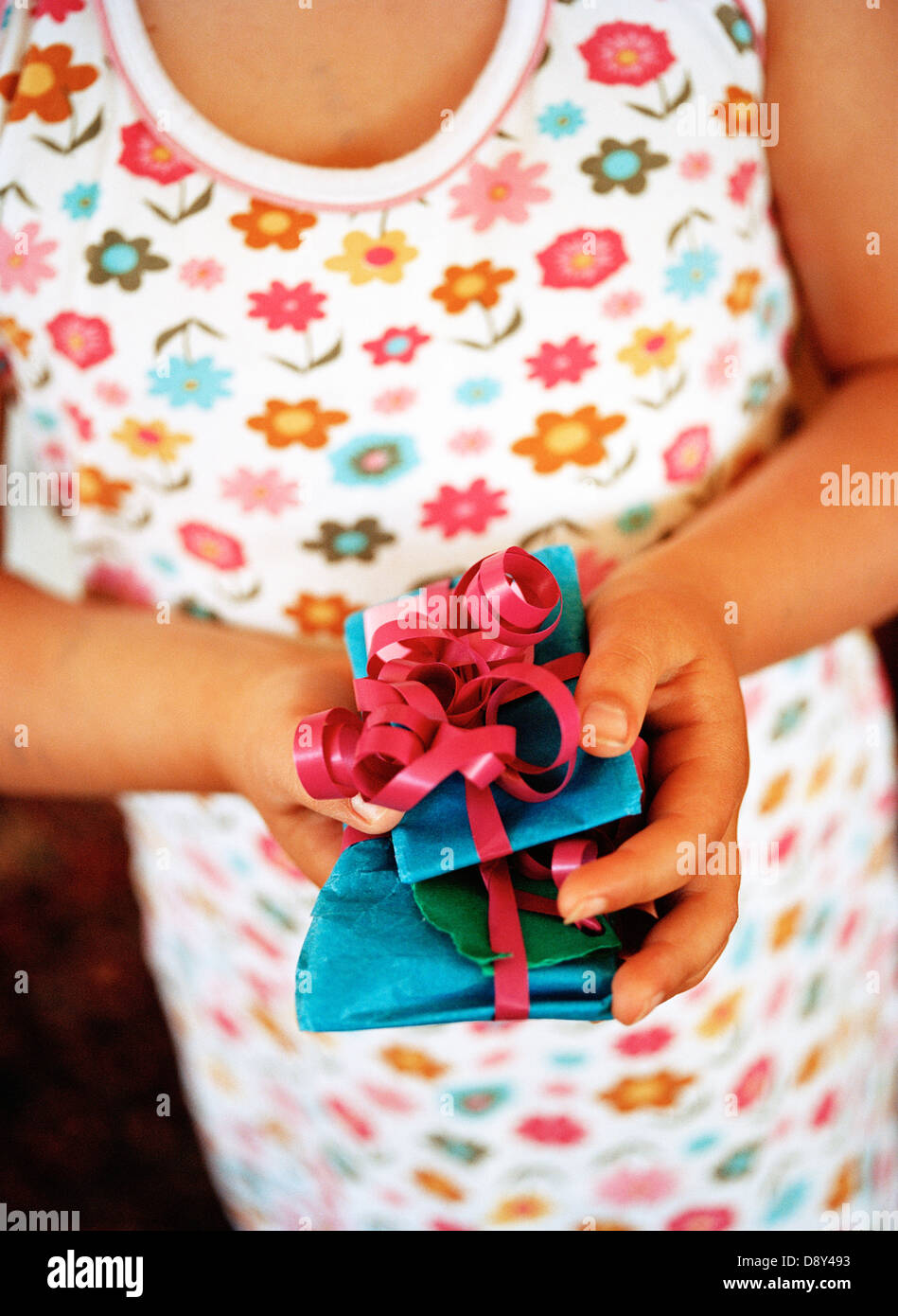 A girl holding presents Stock Photo - Alamy