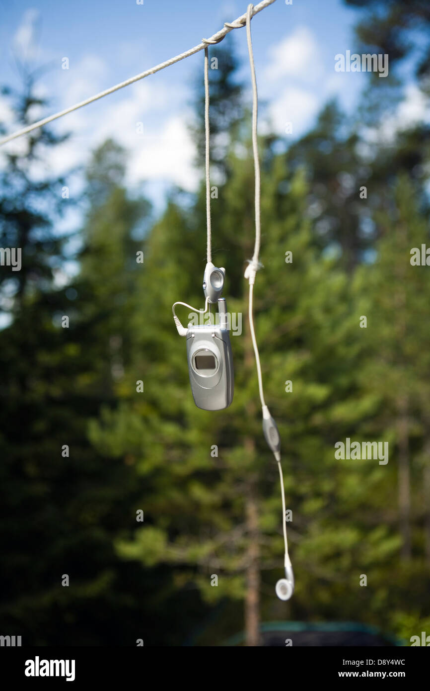 Mobile phone hanging in a clothes line Stock Photo - Alamy