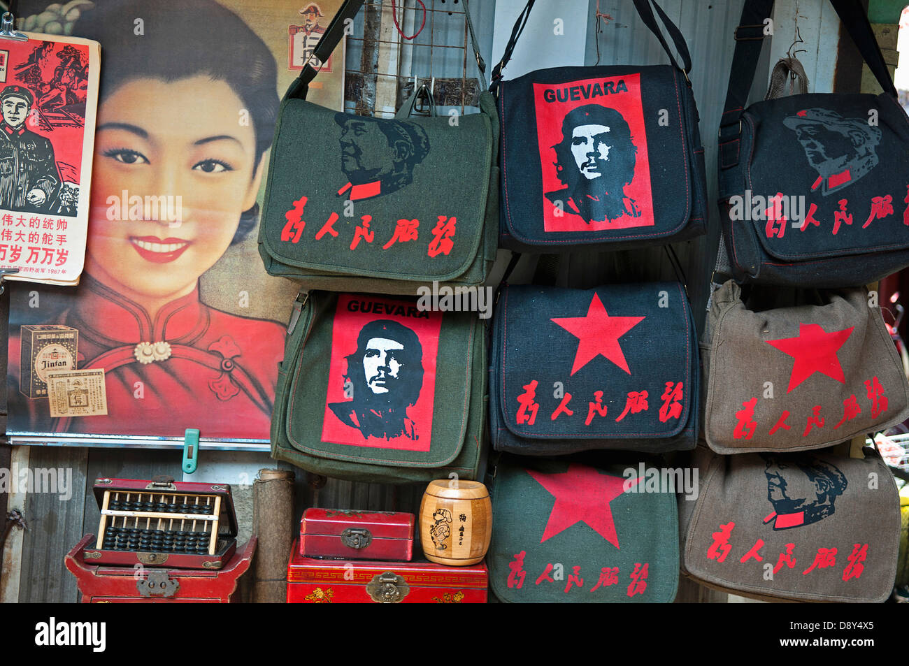 Revolutionary kitsch on sale at at Dongtai antique market Chairman Mao Zedong and Che Guevara and Red Star shoulder bags Stock Photo
