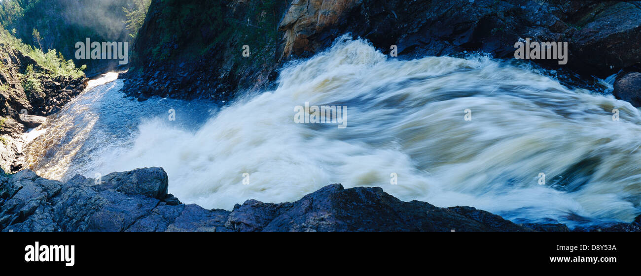 A waterfall in the mountains Stock Photo - Alamy