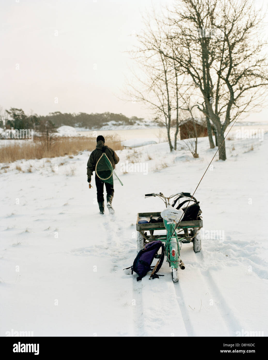 Man with a moped in the winter Stock Photo Alamy