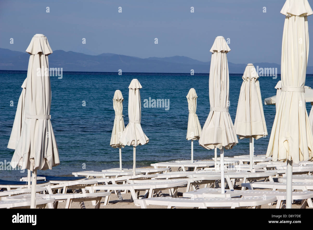 Sunshades and deckchairs on the beach Stock Photo