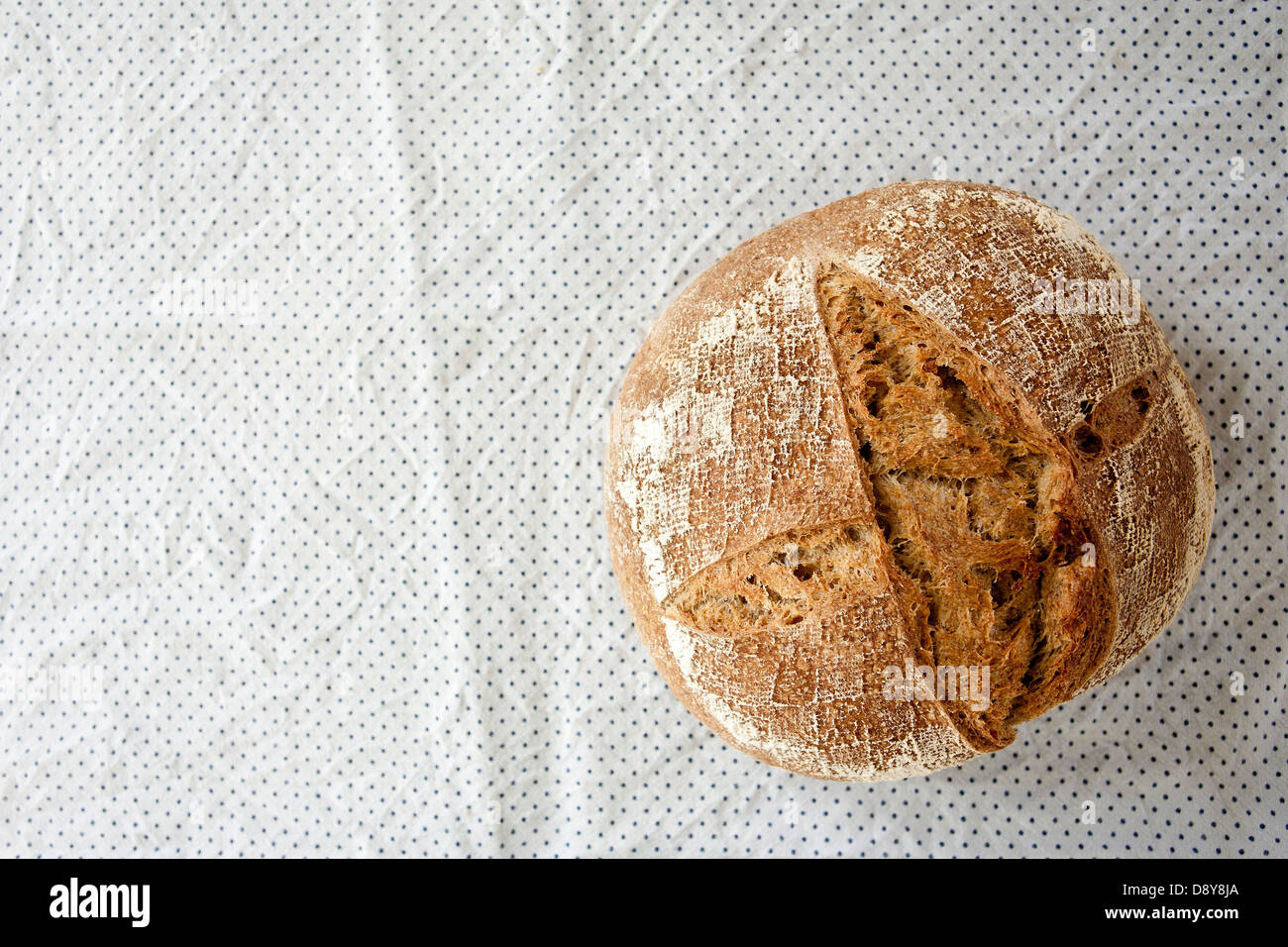 Home made sourdough bread, a cob, a loaf, with crust, from a bakery, a market, fresh organic food. Stock Photo