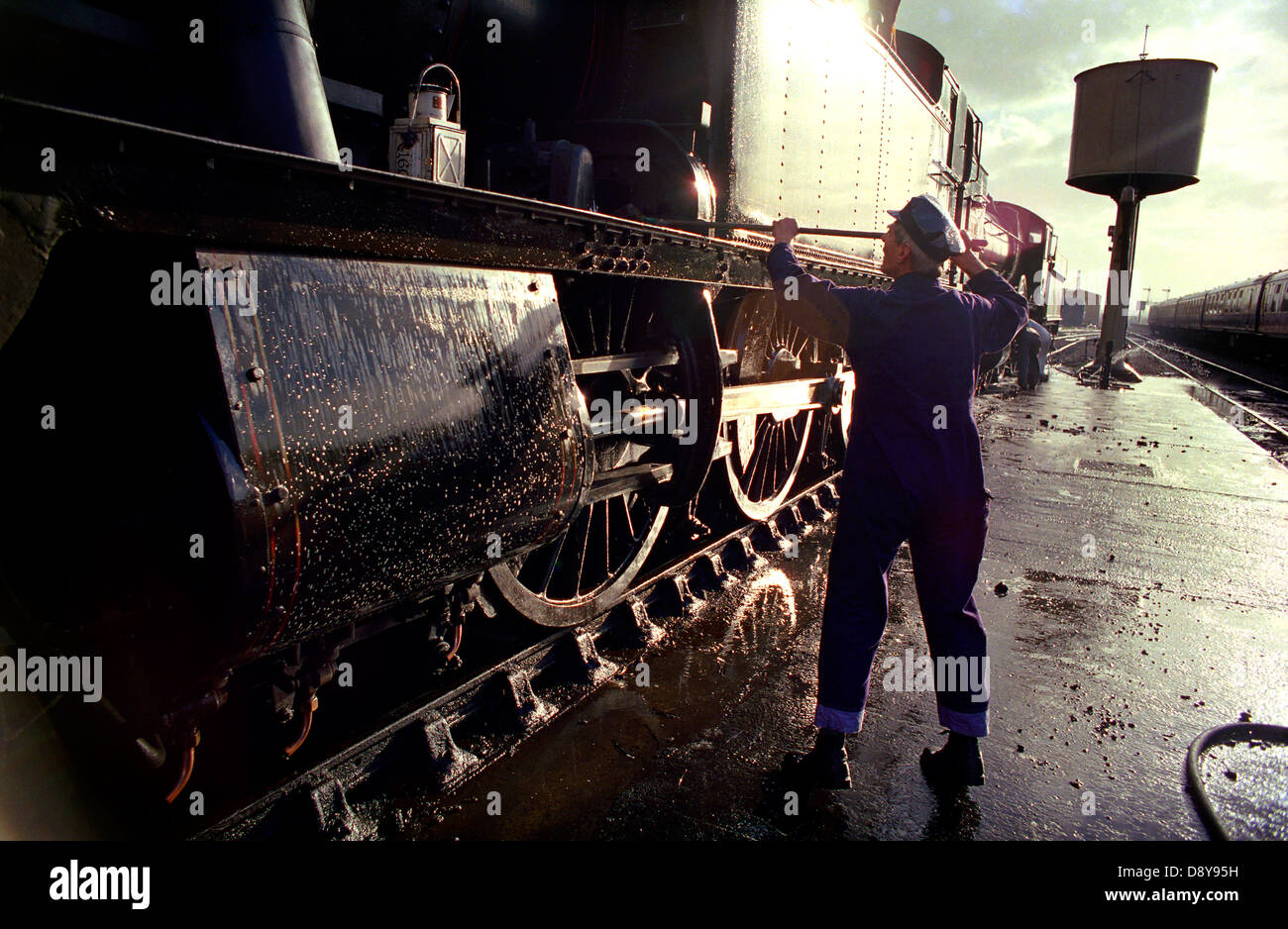 An engine being cleaned at West Somerset Steam Railway at Minehead ...
