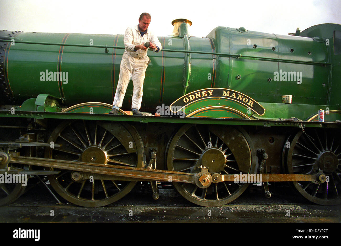 A steam engine being cleaned at West Somerset Railway at Minehead. Stock Photo