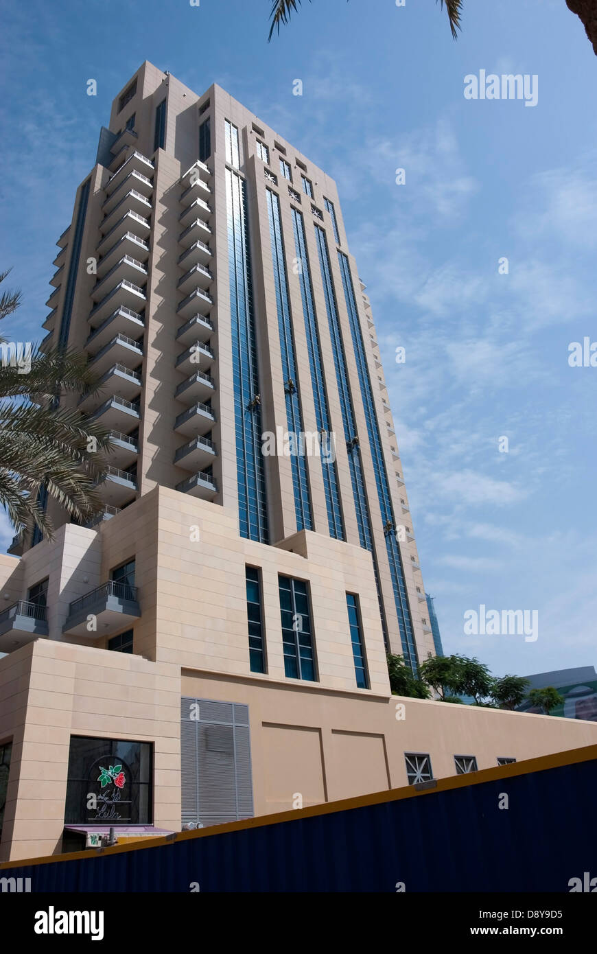 Five Window Cleaners Suspended on the Exterior of Clarens Tower