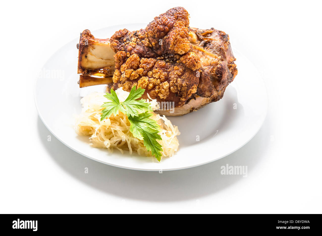 Oktoberfest pork hock on a white plate isolated Stock Photo