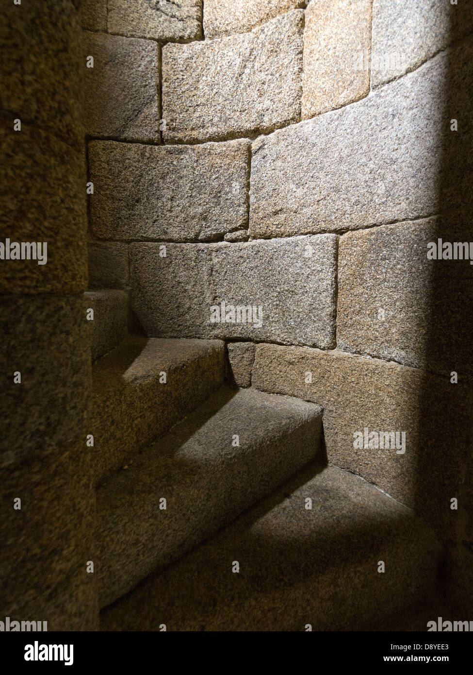 Narrow stone spiral staircase Stock Photo