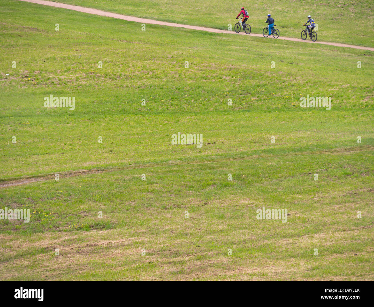 People riding bicycles in the countryside Stock Photo