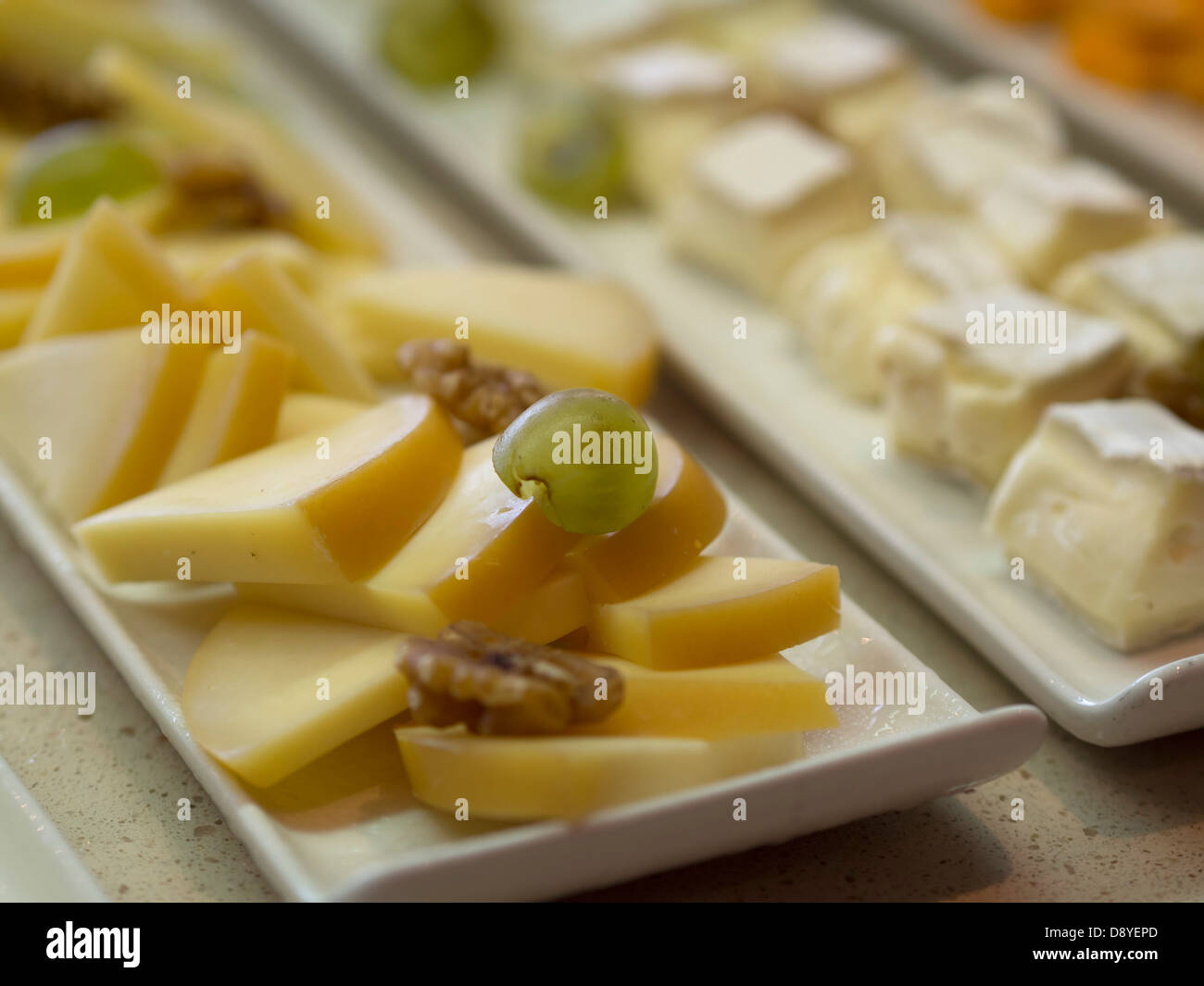 Cheese selection at hotel breakfast buffet table Stock Photo
