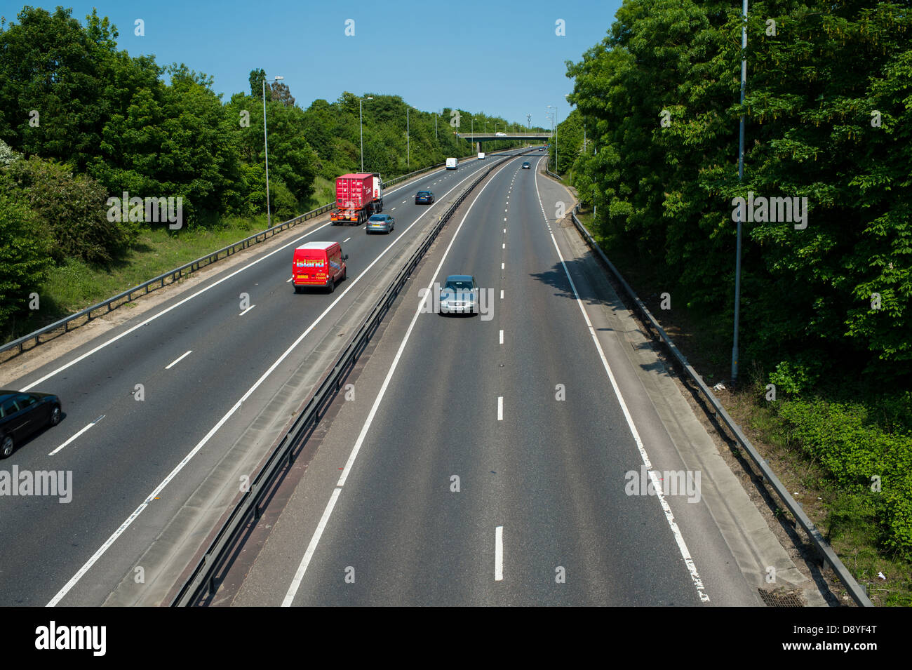 A12 Essex, UK. Vehicles using the outside lane on dual carriageway when no traffic is in nearside lane. Stock Photo