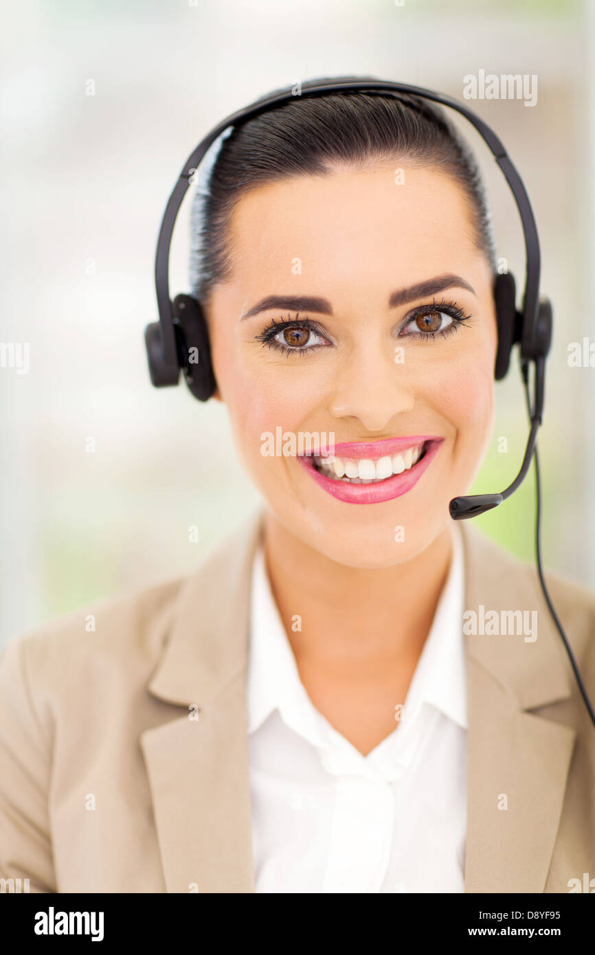 beautiful female customer support operator with headset smiling Stock