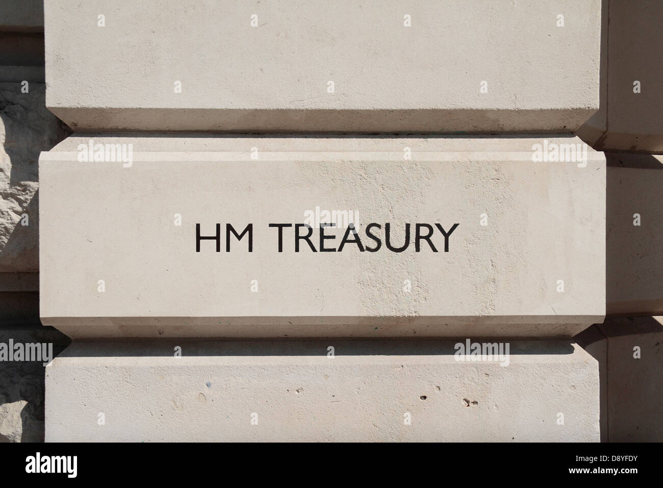HM Treasury printed on the wall outside the HM Treasury entrance on Horse Guards Road, London, UK. Stock Photo