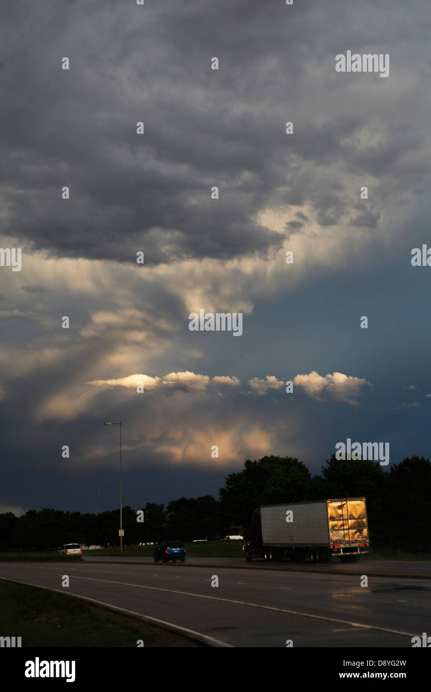 Thunderstorm clouds above a highway. Stock Photo