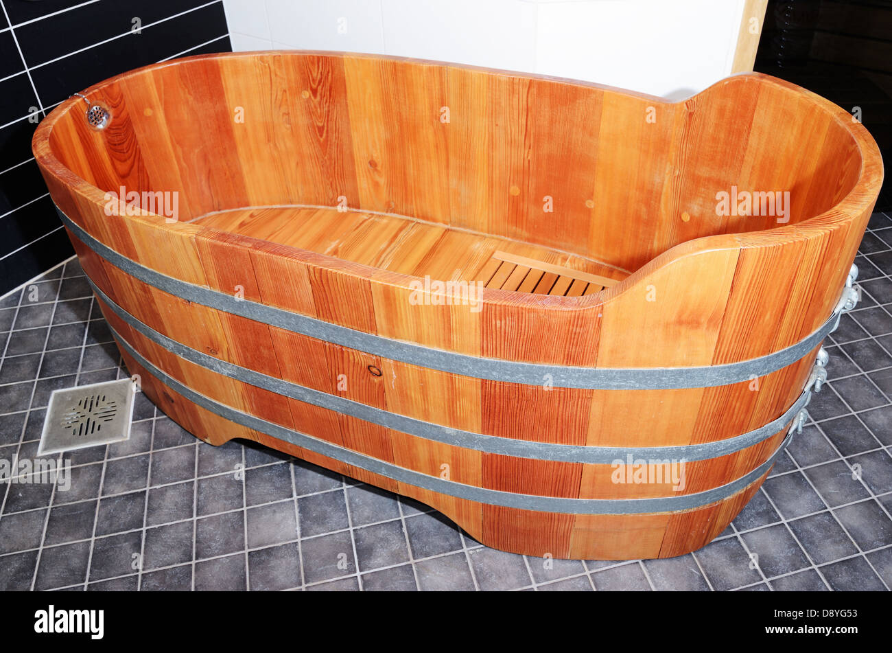 empty vintage wooden bathtube in modern bathroom Stock Photo
