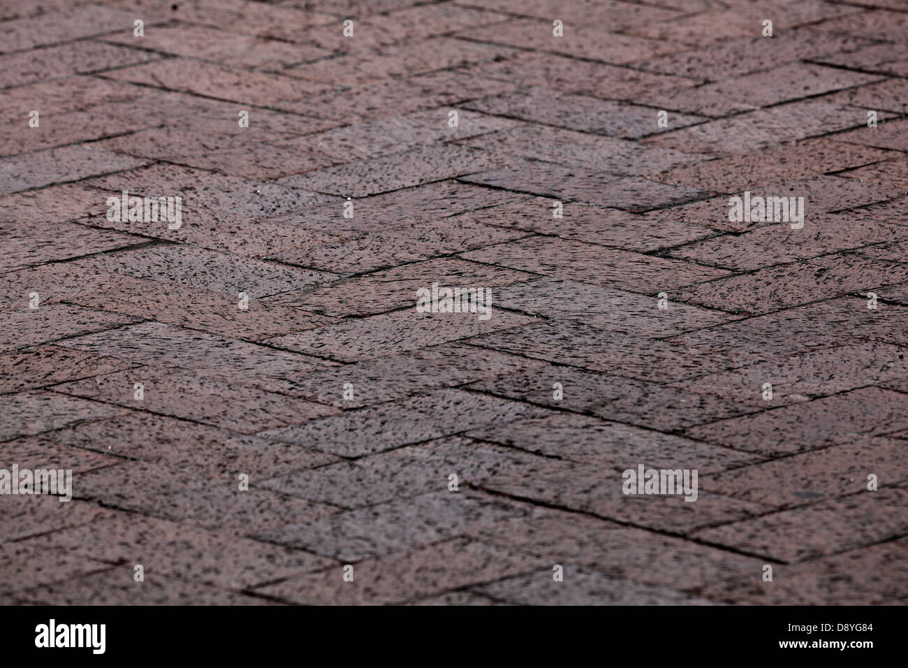 Red paver bricks in chevron pattern Stock Photo