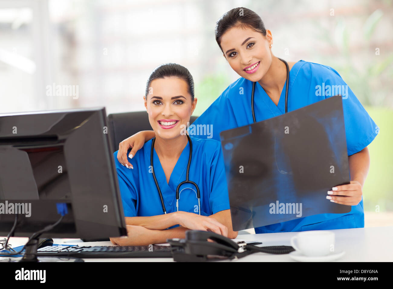 portrait of two young medical workers with x-ray Stock Photo