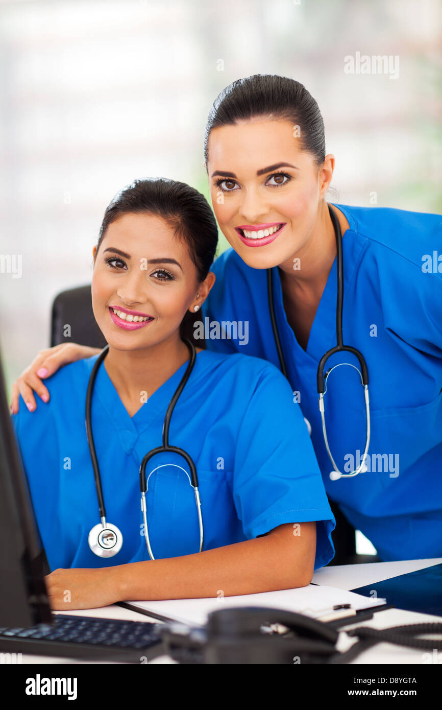 two attractive modern female healthcare workers in office Stock Photo